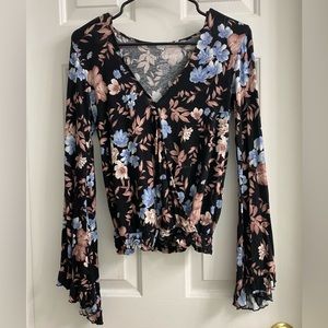 This is a floral top from American Eagle. It is a size XS and true to size.